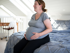 expecting mom holding her belly