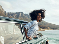 woman looking out the car window