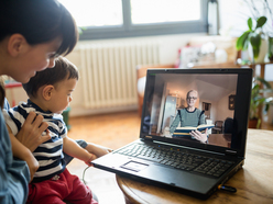 Mom and baby video chatting with a grand mother
