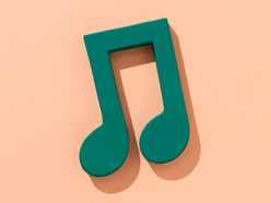 Green musical note on a salmon background